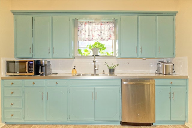 kitchen featuring sink, backsplash, and appliances with stainless steel finishes