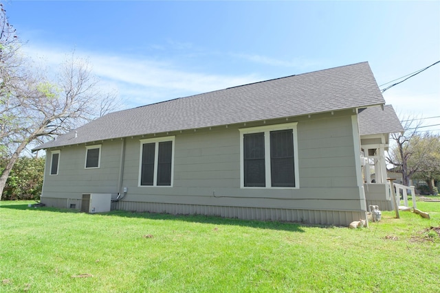 back of house with a yard