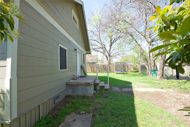 view of yard featuring a trampoline