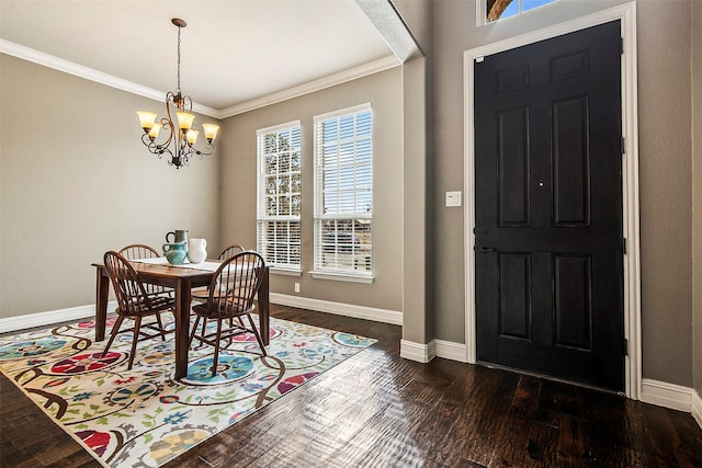 dining area with crown molding, dark wood-type flooring, and a chandelier