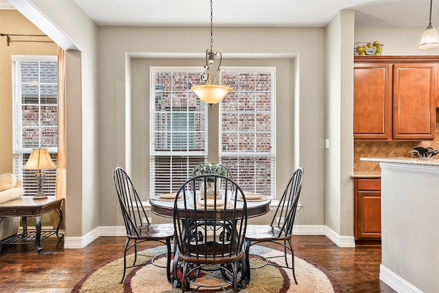 dining room with dark wood-type flooring