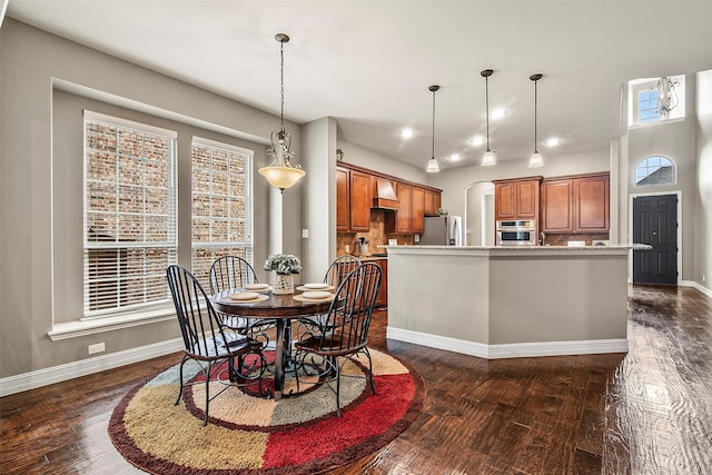 dining area with dark wood-type flooring