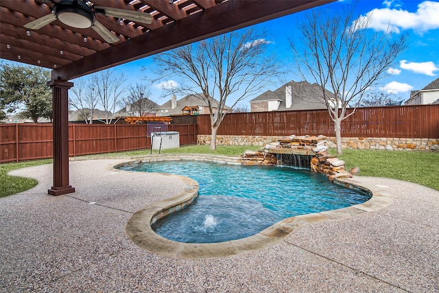 view of swimming pool with pool water feature, a patio, a pergola, and ceiling fan