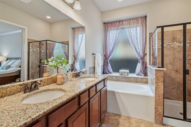 bathroom featuring separate shower and tub and vanity