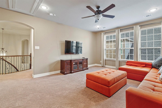 carpeted living room featuring ceiling fan