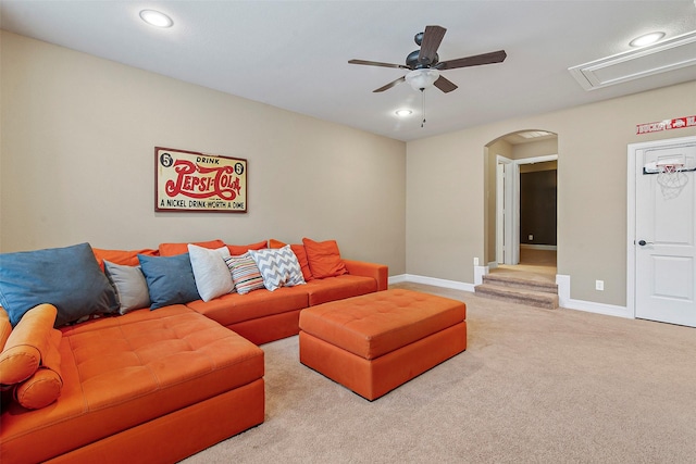 living room featuring light colored carpet and ceiling fan