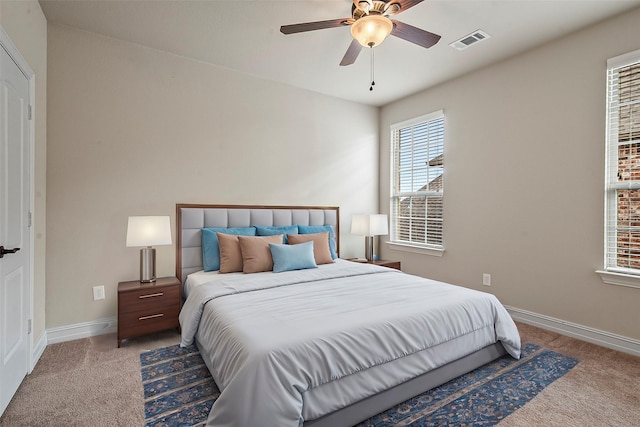 carpeted bedroom featuring ceiling fan