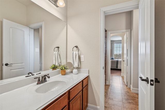 bathroom with tile patterned floors and vanity