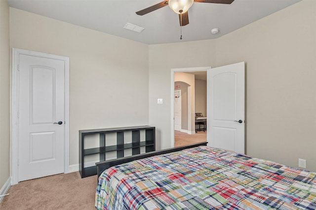 bedroom featuring ceiling fan and light colored carpet