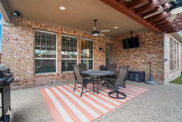 view of patio featuring area for grilling and ceiling fan