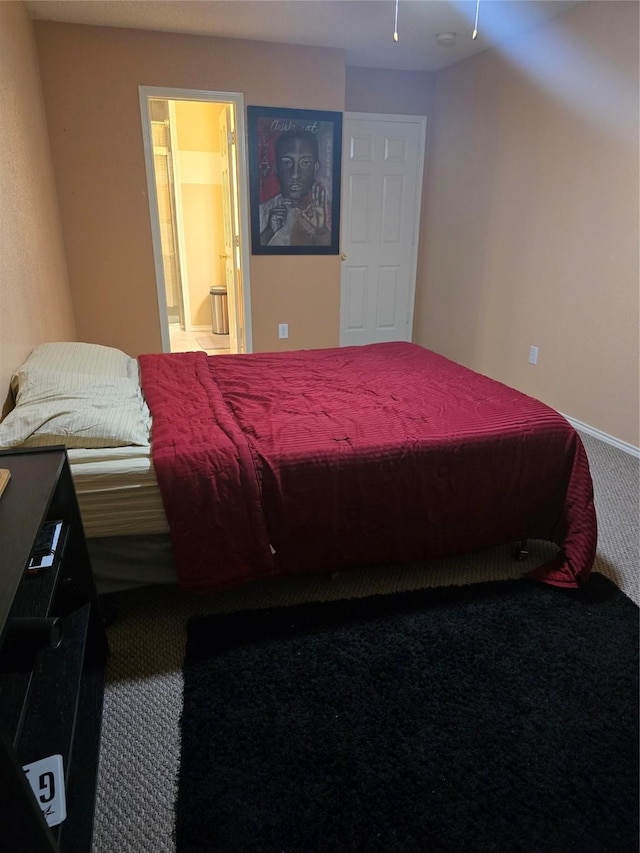 carpeted bedroom with ensuite bathroom