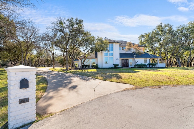 view of front of property with a front lawn