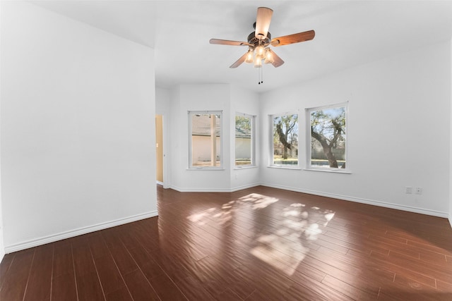 spare room featuring ceiling fan and dark hardwood / wood-style flooring