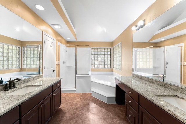 bathroom featuring plenty of natural light, vanity, and separate shower and tub