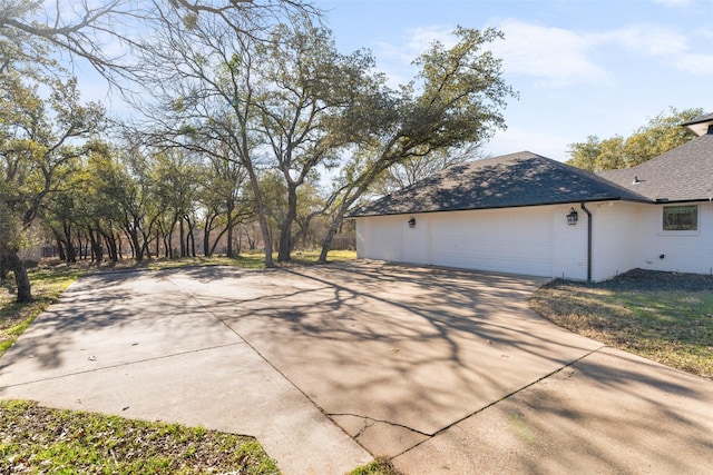 view of side of property featuring a garage