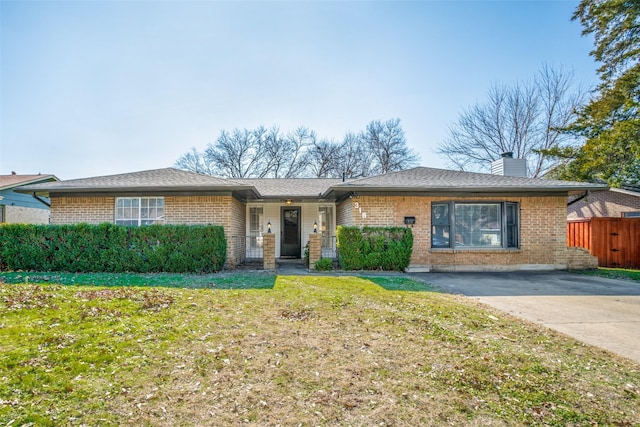 ranch-style home featuring a front yard