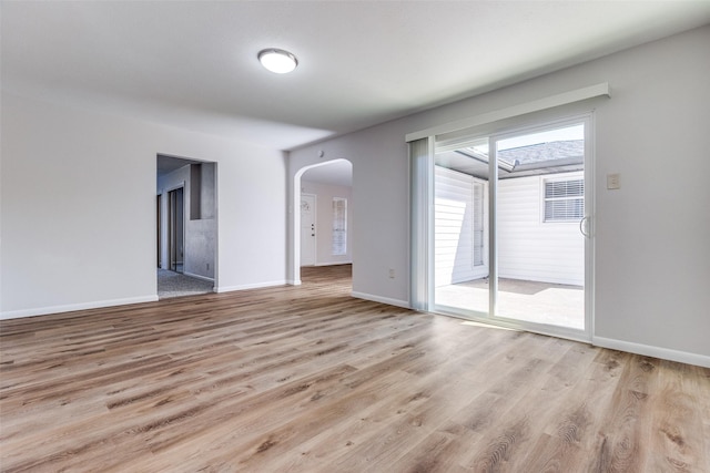 unfurnished room with light hardwood / wood-style floors