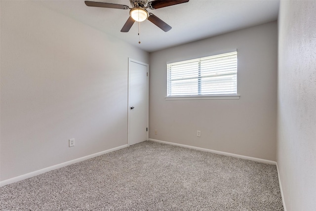 spare room featuring carpet flooring and ceiling fan