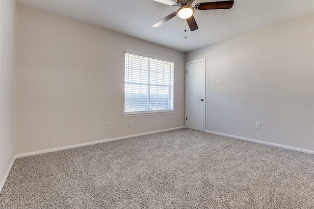 spare room featuring ceiling fan and carpet flooring