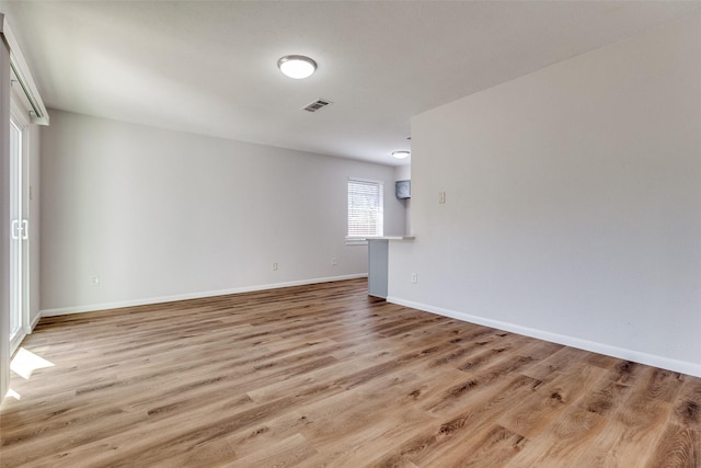 spare room with light wood-type flooring