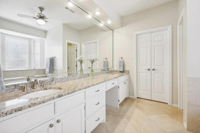 bathroom featuring tile patterned flooring, ceiling fan, and vanity