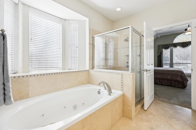 bathroom with independent shower and bath and tile patterned flooring