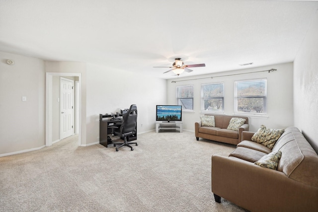 carpeted living room featuring ceiling fan