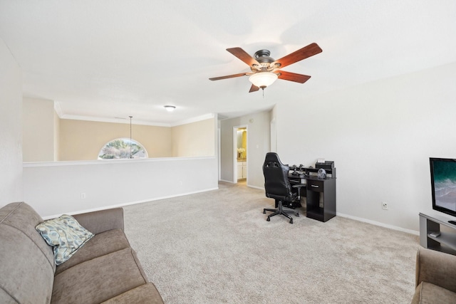 office area featuring light carpet, ceiling fan, and ornamental molding