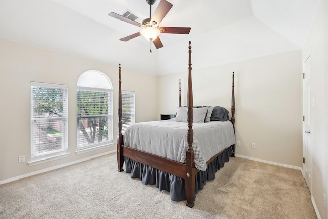 carpeted bedroom featuring ceiling fan and vaulted ceiling