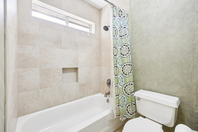 bathroom with toilet and shower / tub combo with curtain