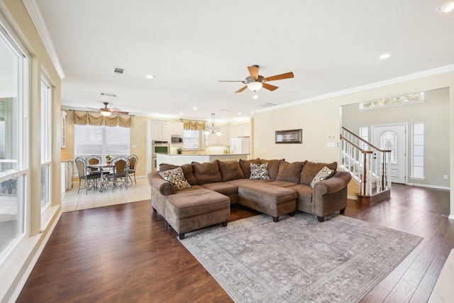 living room with sink, ornamental molding, and dark hardwood / wood-style flooring