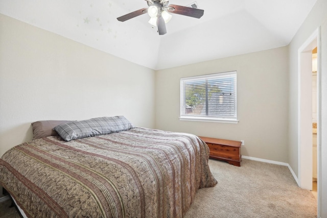 carpeted bedroom featuring ceiling fan and vaulted ceiling