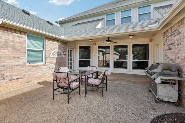 view of patio with ceiling fan and a grill