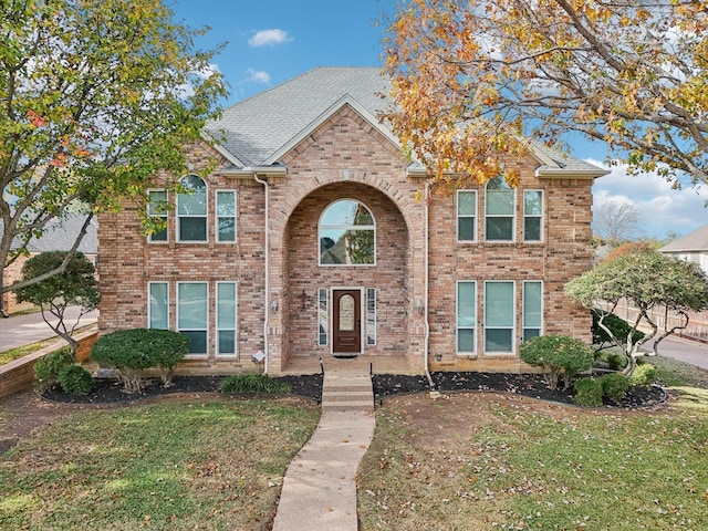 view of front property with a front lawn