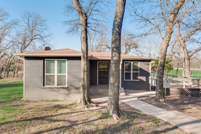 view of front of property with a wooden deck