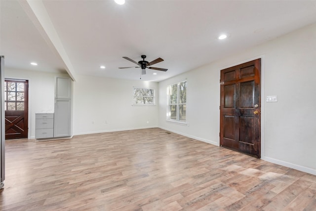 interior space featuring light hardwood / wood-style floors and ceiling fan