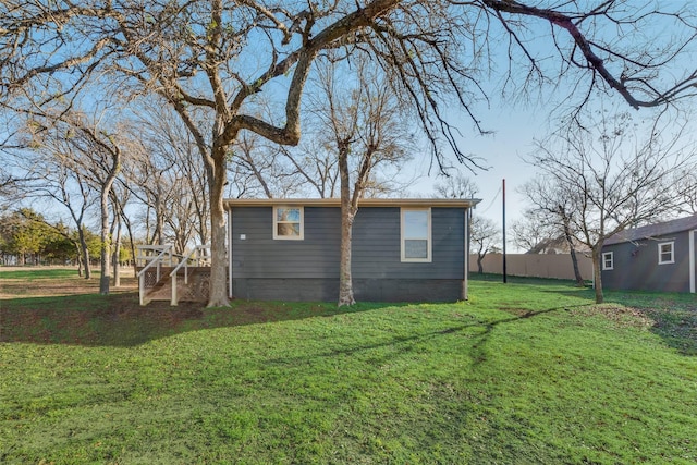 view of side of home featuring a lawn