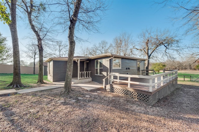 rear view of house with a wooden deck