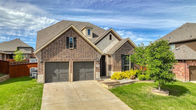 view of front facade featuring a garage and a front yard