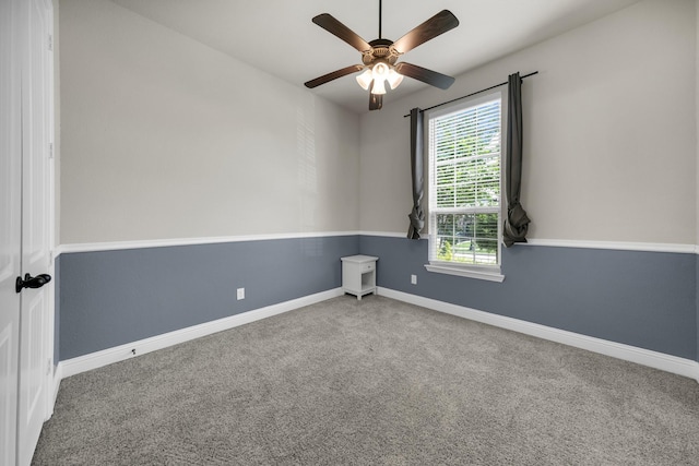 empty room featuring carpet flooring and ceiling fan