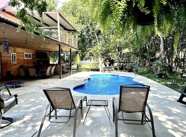 view of pool featuring a patio area and an outdoor bar