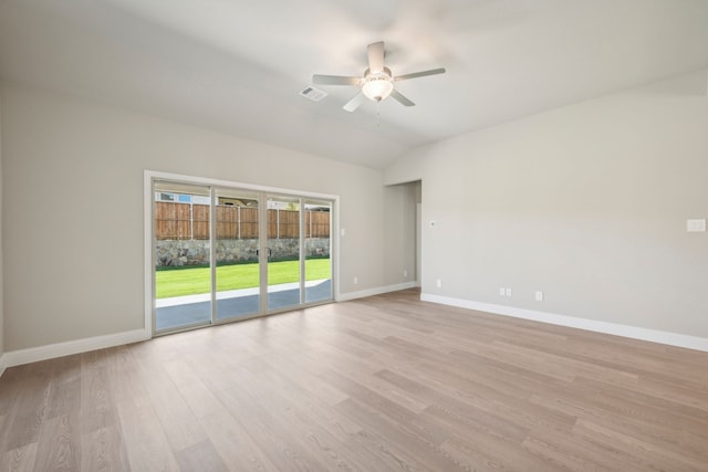 unfurnished room with ceiling fan, vaulted ceiling, and light hardwood / wood-style flooring