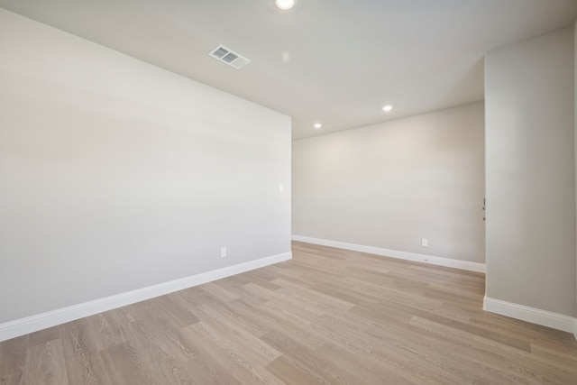 spare room with light hardwood / wood-style flooring