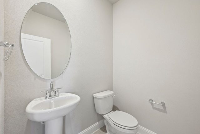 bathroom featuring sink and toilet