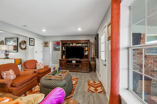 living room with light hardwood / wood-style floors