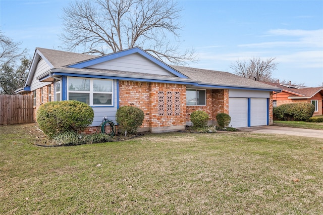 ranch-style home with a front yard and a garage