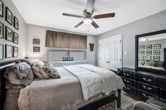 bedroom with a closet, ceiling fan, and wood-type flooring