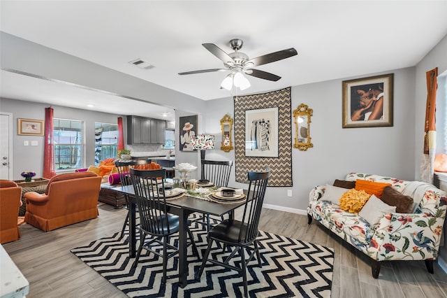 dining space featuring light hardwood / wood-style floors and ceiling fan