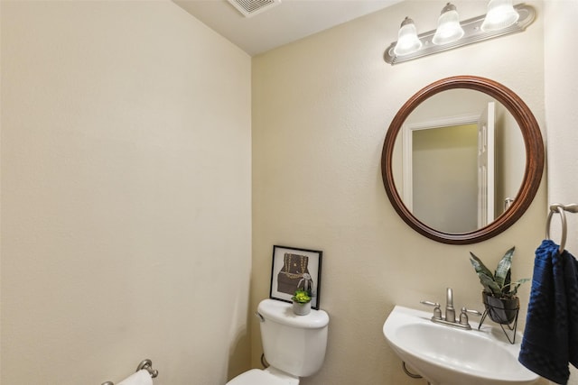 bathroom with sink and toilet