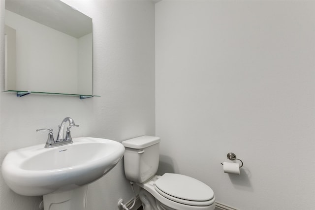 bathroom with sink and toilet